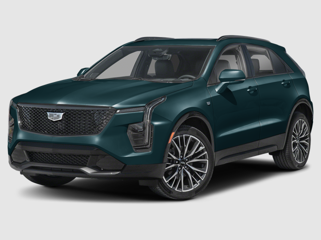 A teal Cadillac XT4 SUV parked, showcasing its sleek design and shiny wheels.