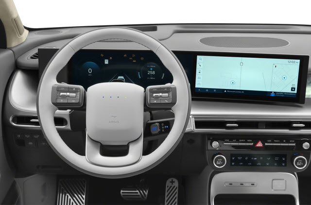 A modern 2026 Hyundai IONIQ 9 Performance Calligraphy Design dashboard featuring a digital steering wheel and dual screens showing maps and speed.